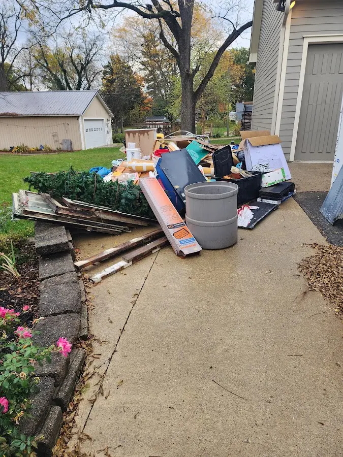 Dumpster being loaded with debris for Estate Cleanout Dumpster Rental in Manti